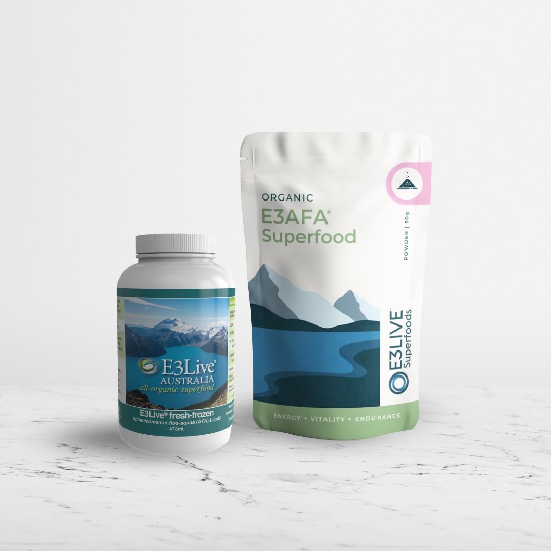 E3Live Superfood bottle and pack of Organic E3AFA Superfood powder on a light grey background