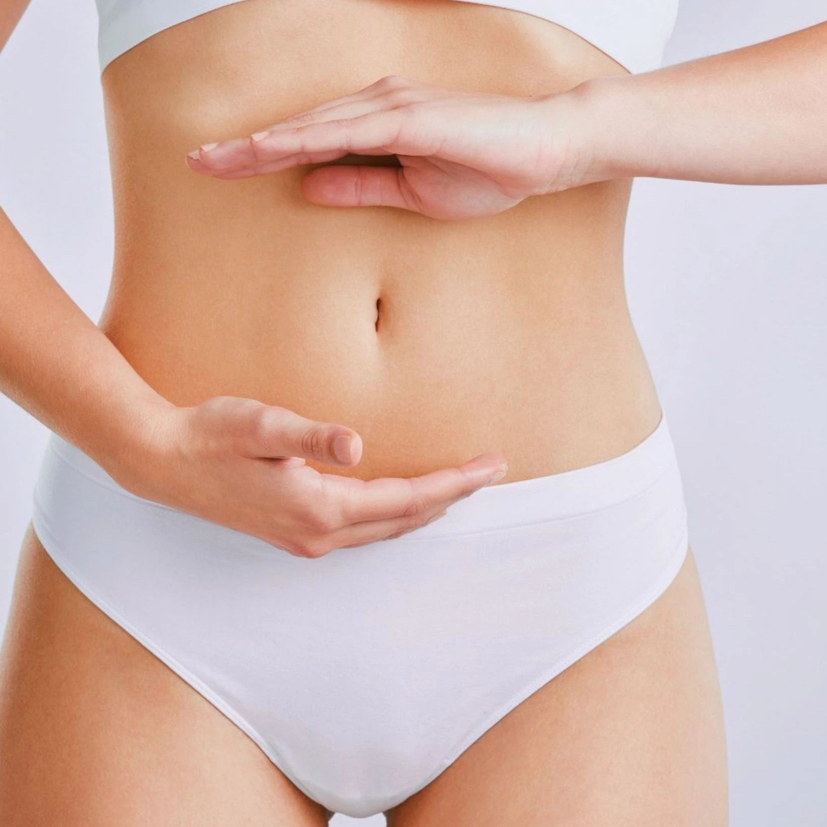 Person with hands on stomach representing Ultimate Gut Health