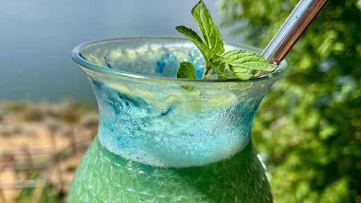 Glass of Green Smoothie featuring E3AFA and BlueMAJIK powder.