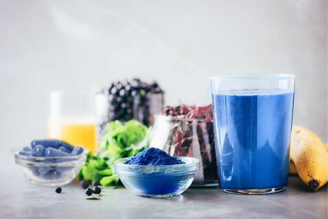 BlueMAJIK Algae Supplements Collection with a vibrant blue smoothie
