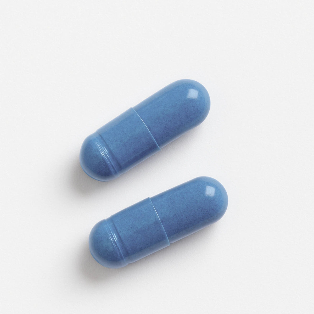 Two BlueMAJIK capsules on a white background