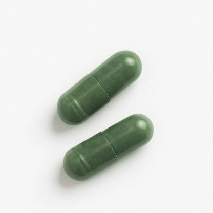 Two green BrainON capsules on a white background