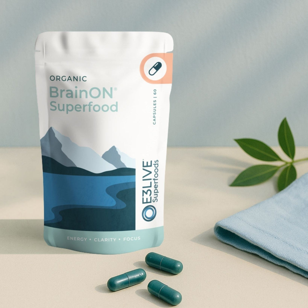 Packaging of Organic BrainON Superfood with capsules on a neutral background
