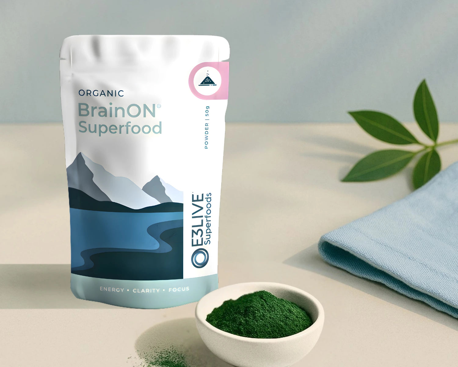 BrainON Superfood package with a bowl of green powder on a light surface.