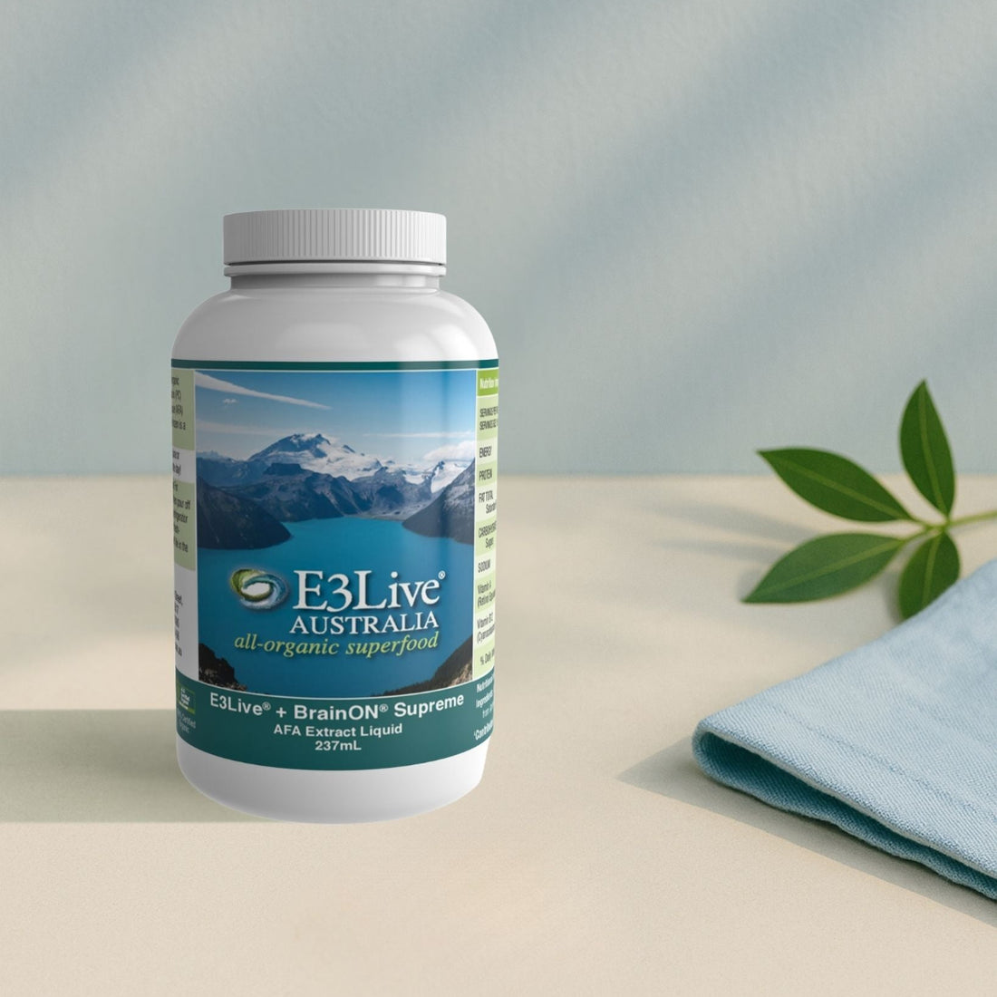 E3Live Australia's BrainON supplement bottle on a light surface with a blurred background