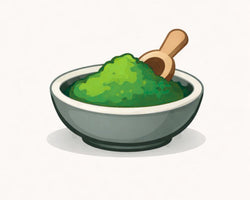 Bowl of green AFA powder with a wooden scoop on a white background