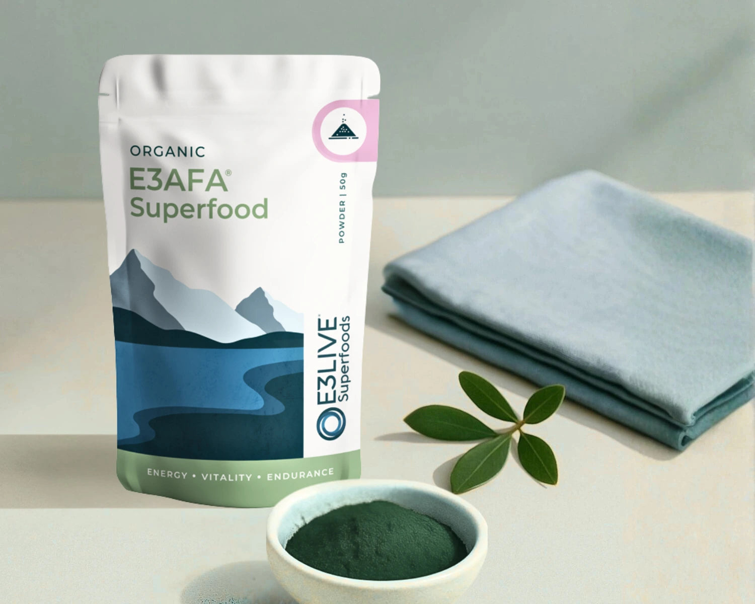 E3AFA Superfood package with a bowl of powder and a cloth on a light surface.