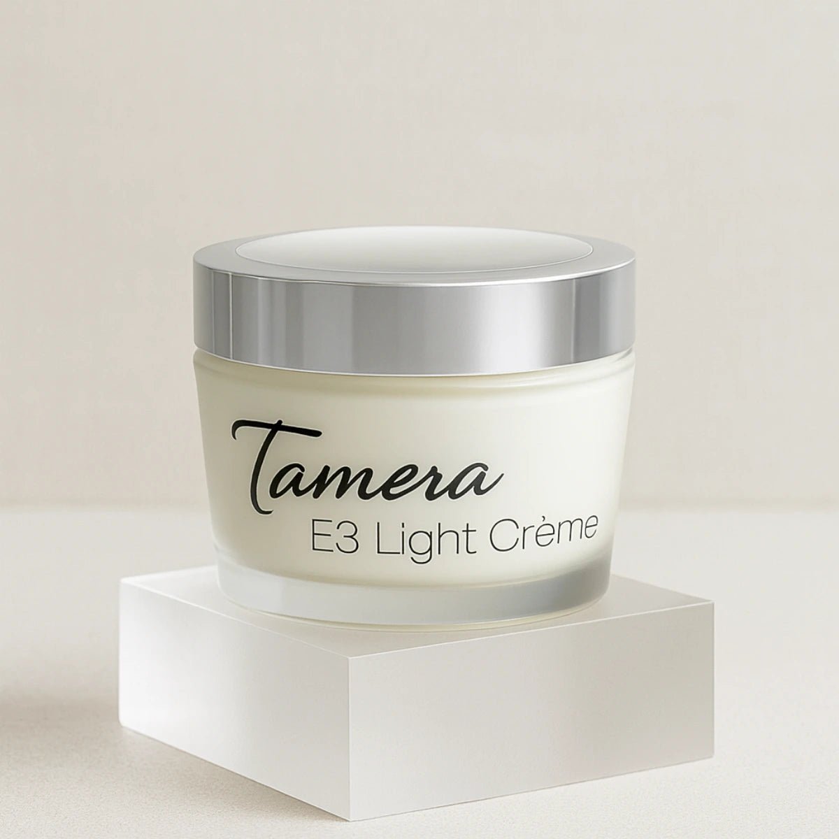 Jar of Tamera E3 Light Creme on a  clear acrylic stand