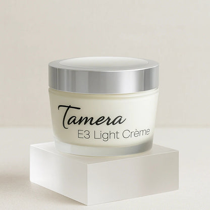 Jar of Tamera E3 Light Creme on a  clear acrylic stand
