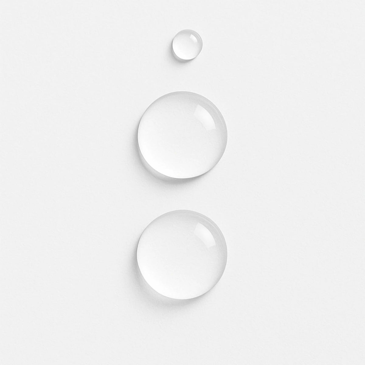 Close-up of E3 Nano Silver droplets on a light grey surface