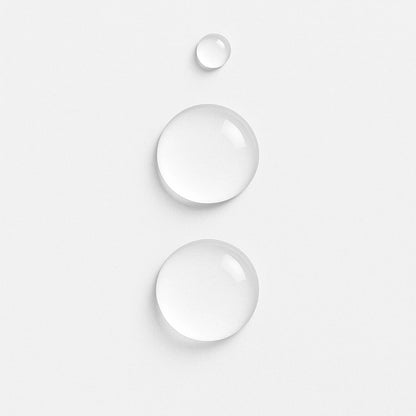 Close-up of E3 Nano Silver droplets on a light grey surface