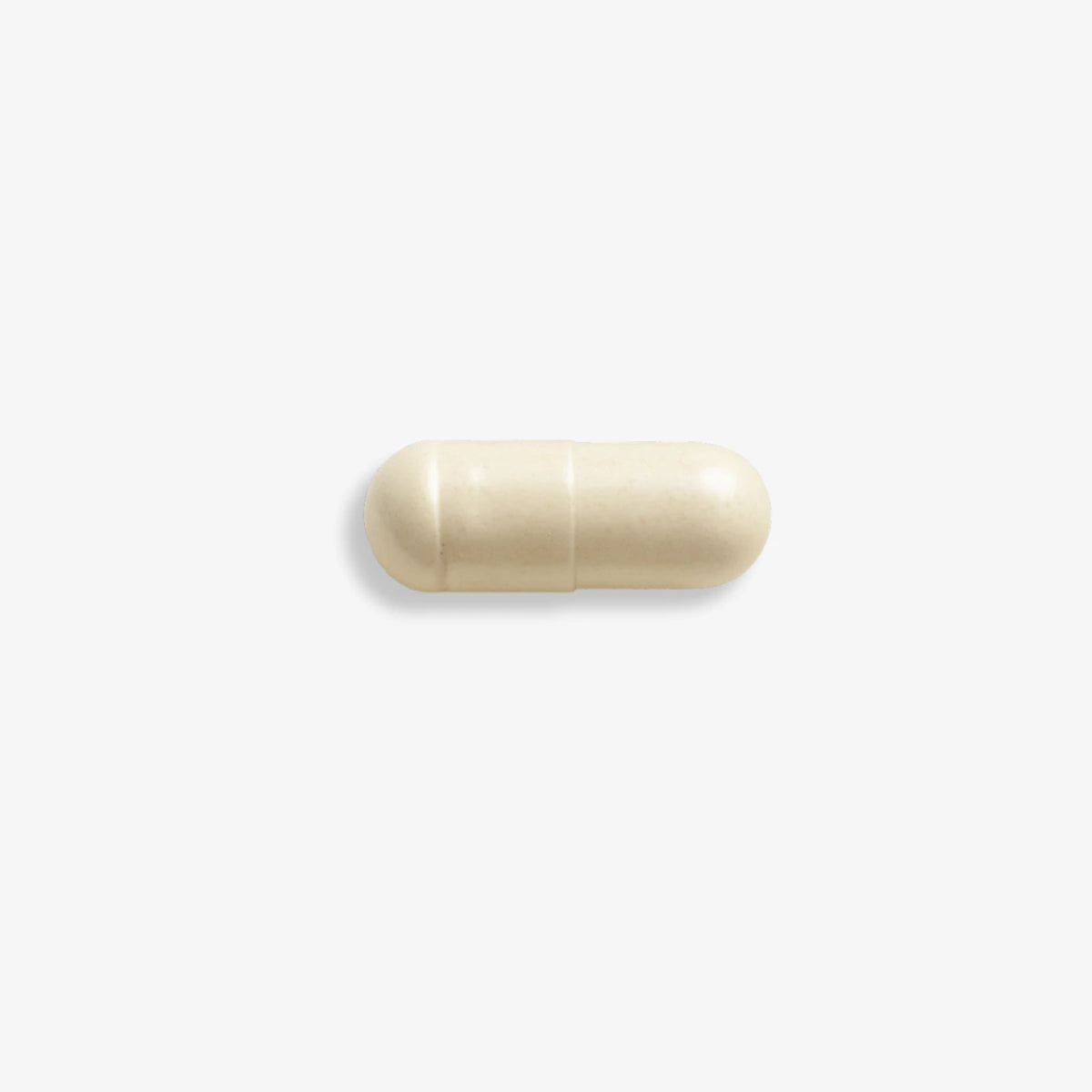 Single E3Probiotics capsule on light grey surface