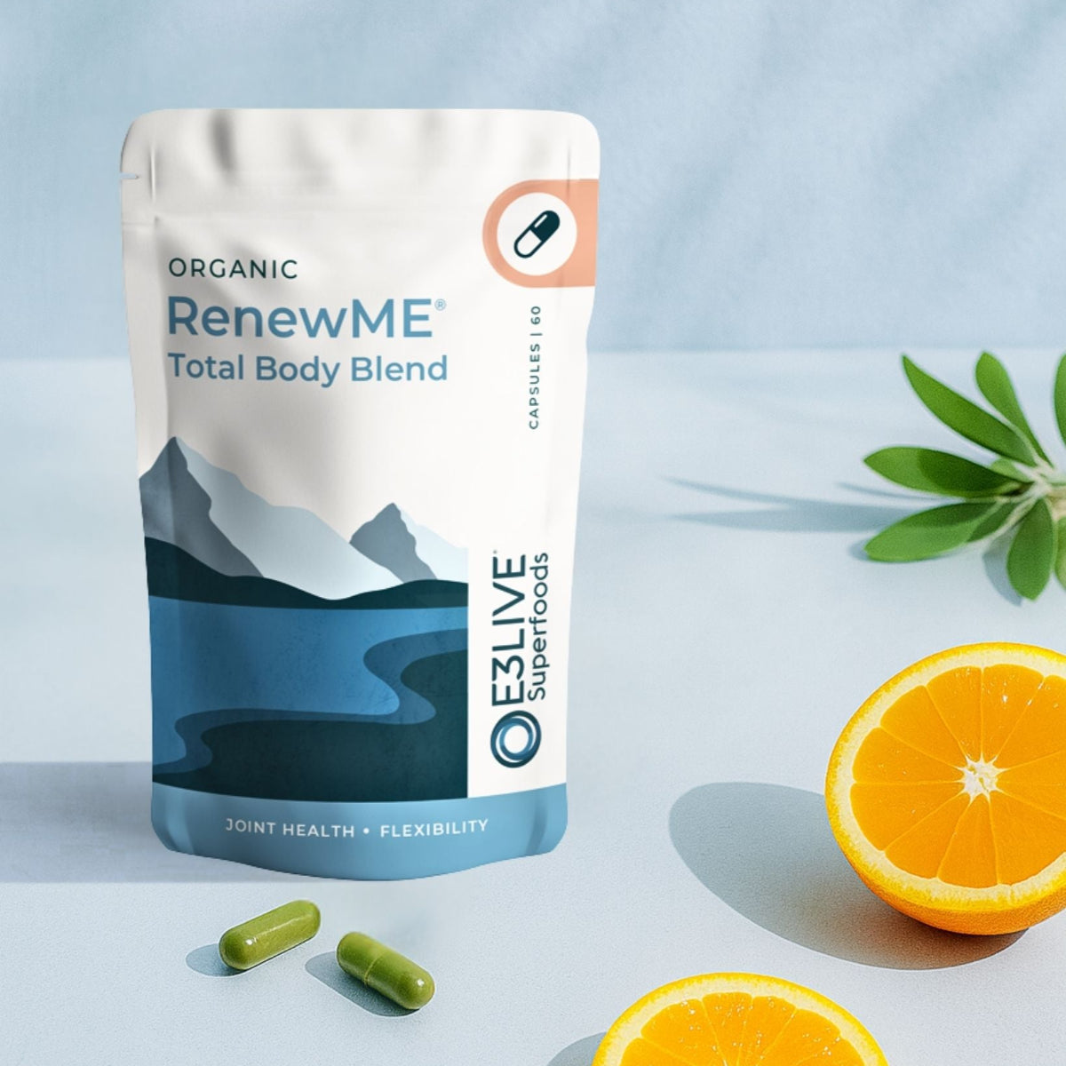 Packaging of Organic RenewME Total Body Blend with oranges on a light blue background