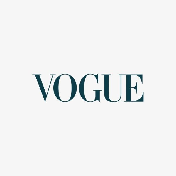 Vogue logo in teal on a light gray background