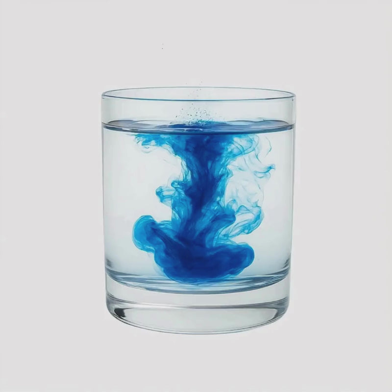 BlueMAJIK swirling in a glass of water